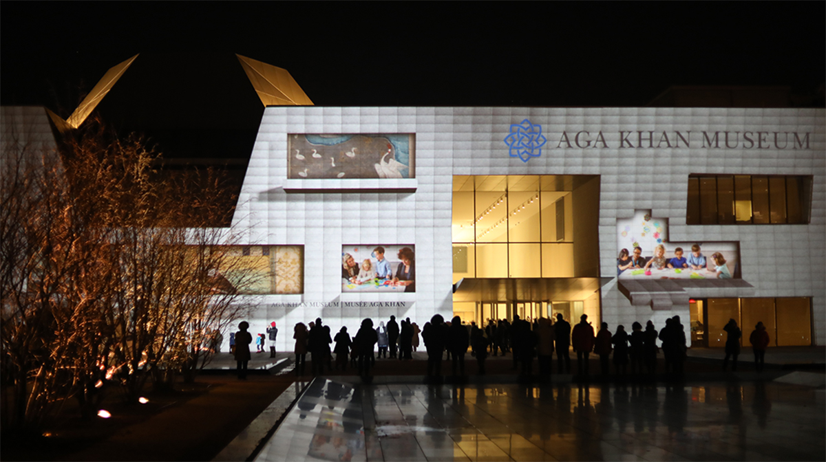 Digital windows open on the Museum's facade, revealing past events.